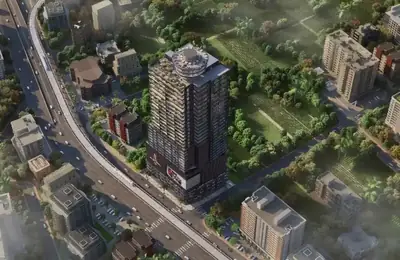 Aerial daytime view showing the tower and its road frontage